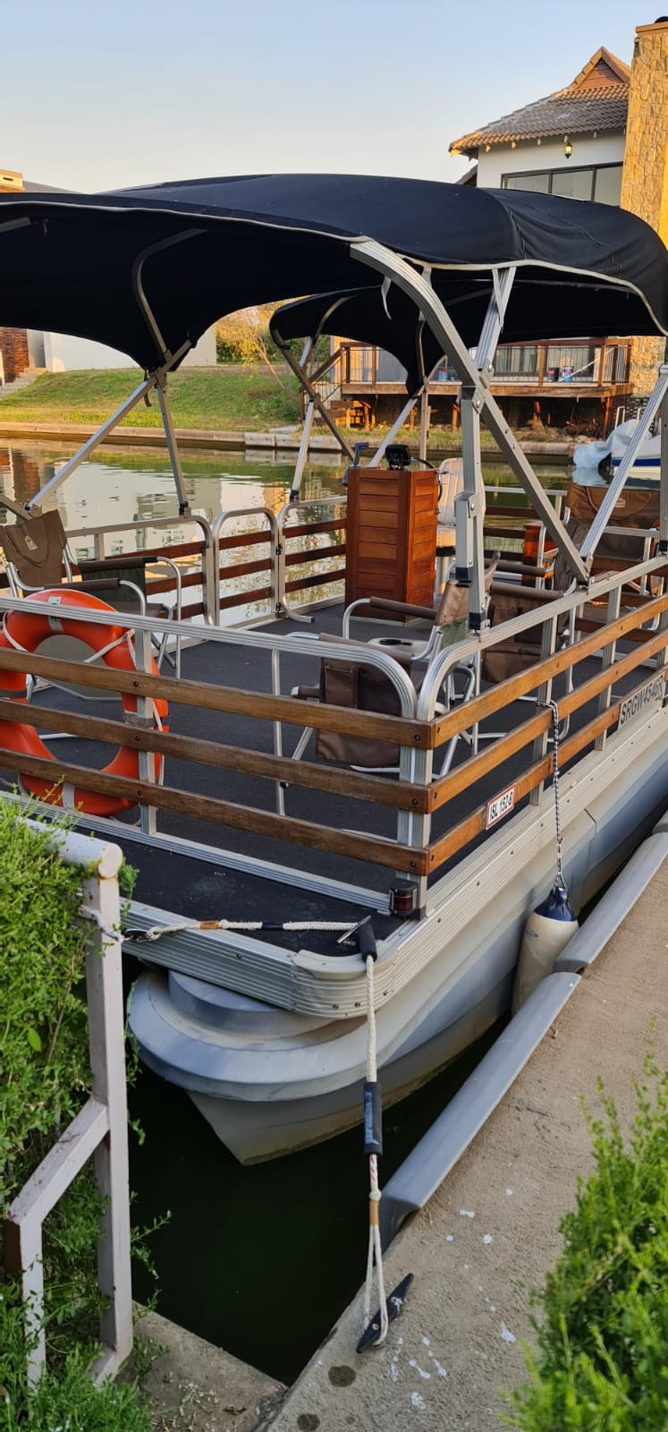 Main pontoon boat deck layout, helm console, bench seating and boarding line, portrait detail