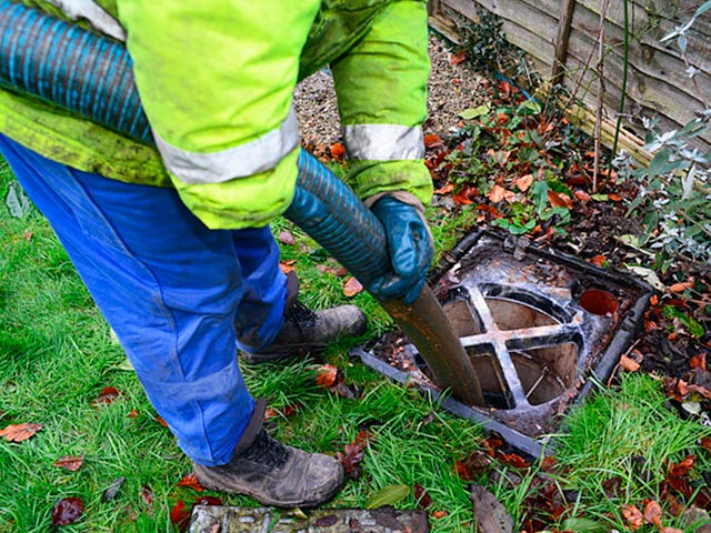 All Counties Plumbing technician operating professional drain cleaning cabling equipment