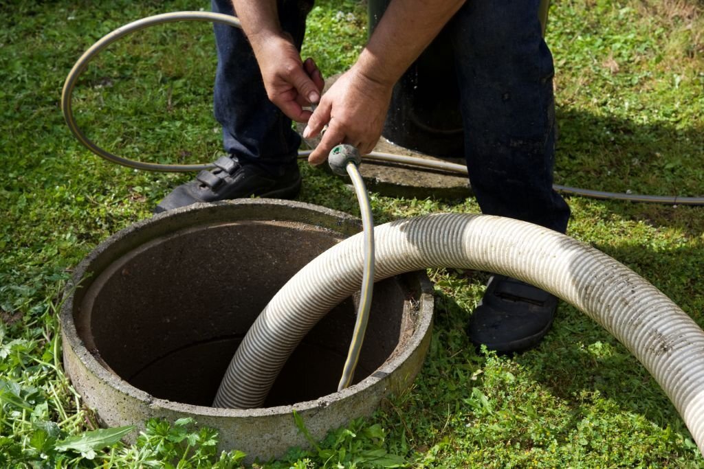 All Counties Plumbing septic tank pumping and maintenance vacuum truck in action