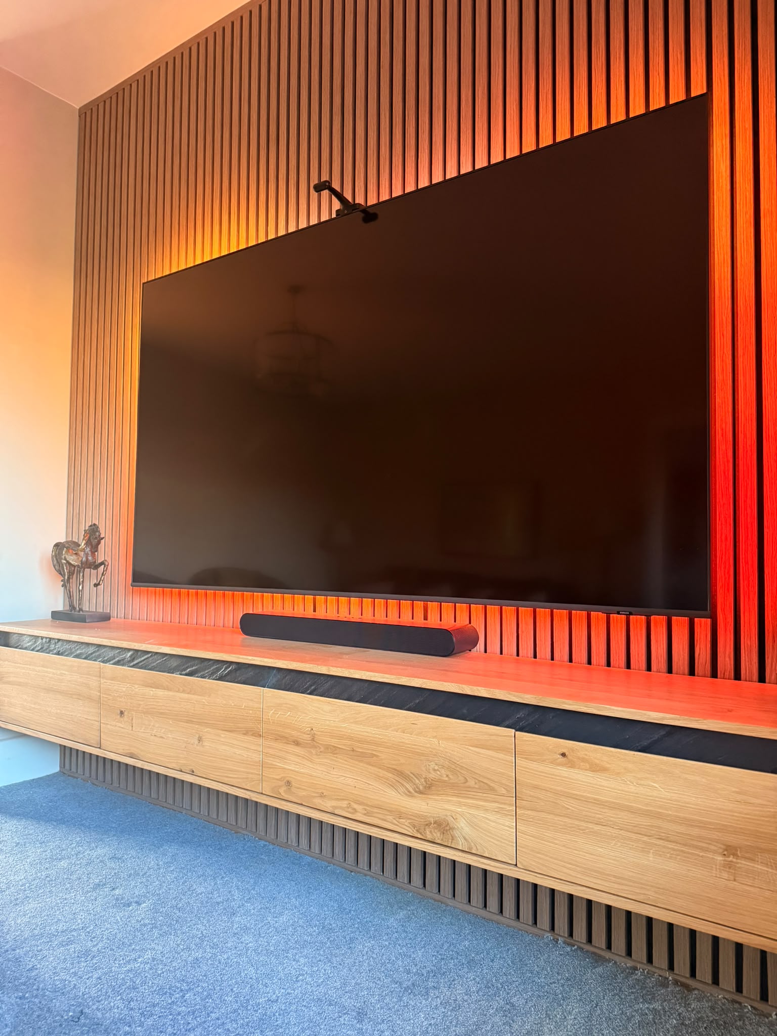 Contemporary backlit slat media wall & floating unit — Salisbury