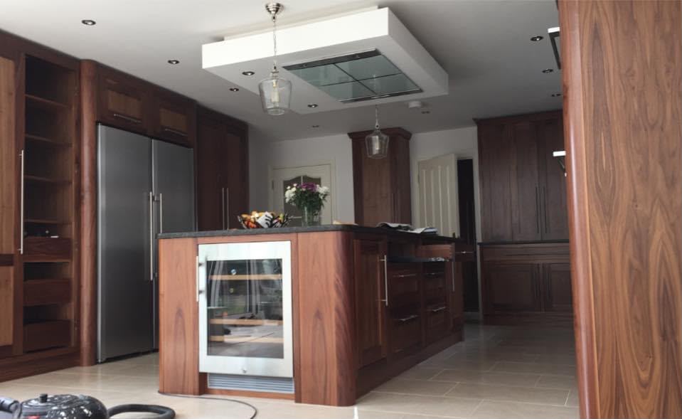 Curved walnut kitchen island with wine cooler — Salisbury