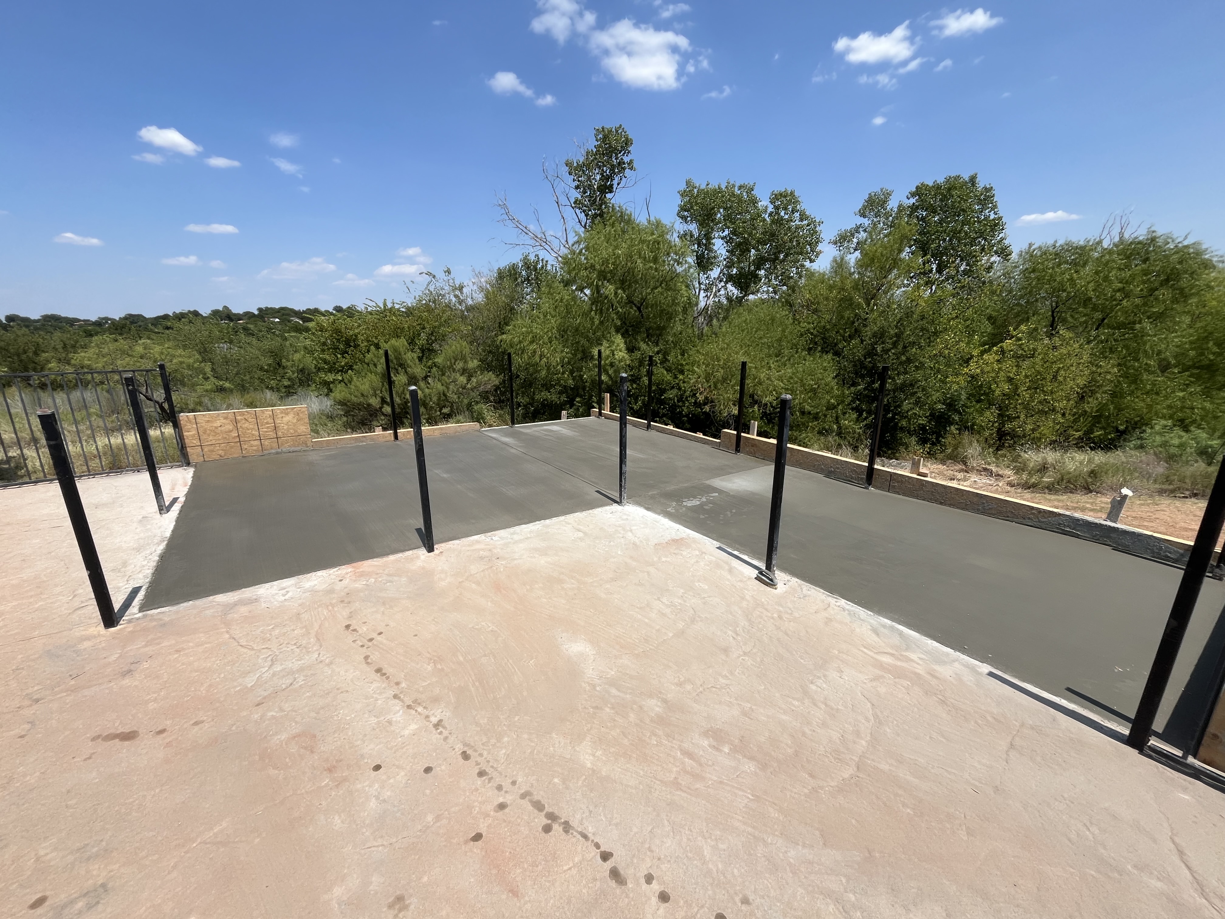 Concrete patio slab prepared for outdoor cover structure