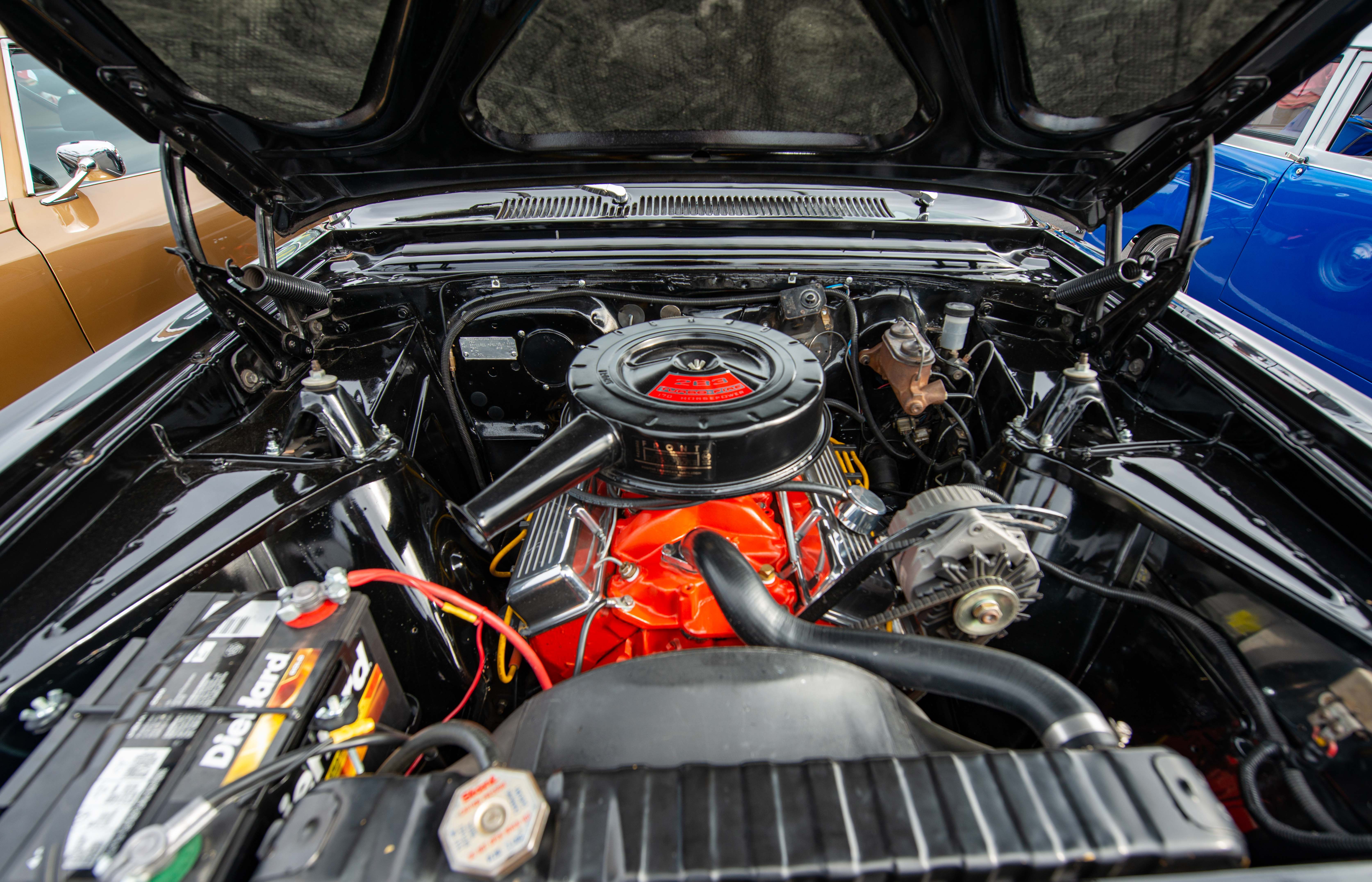 Classic vehicle engine bay and powertrain undergoing mechanical service at Larry's Auto Service