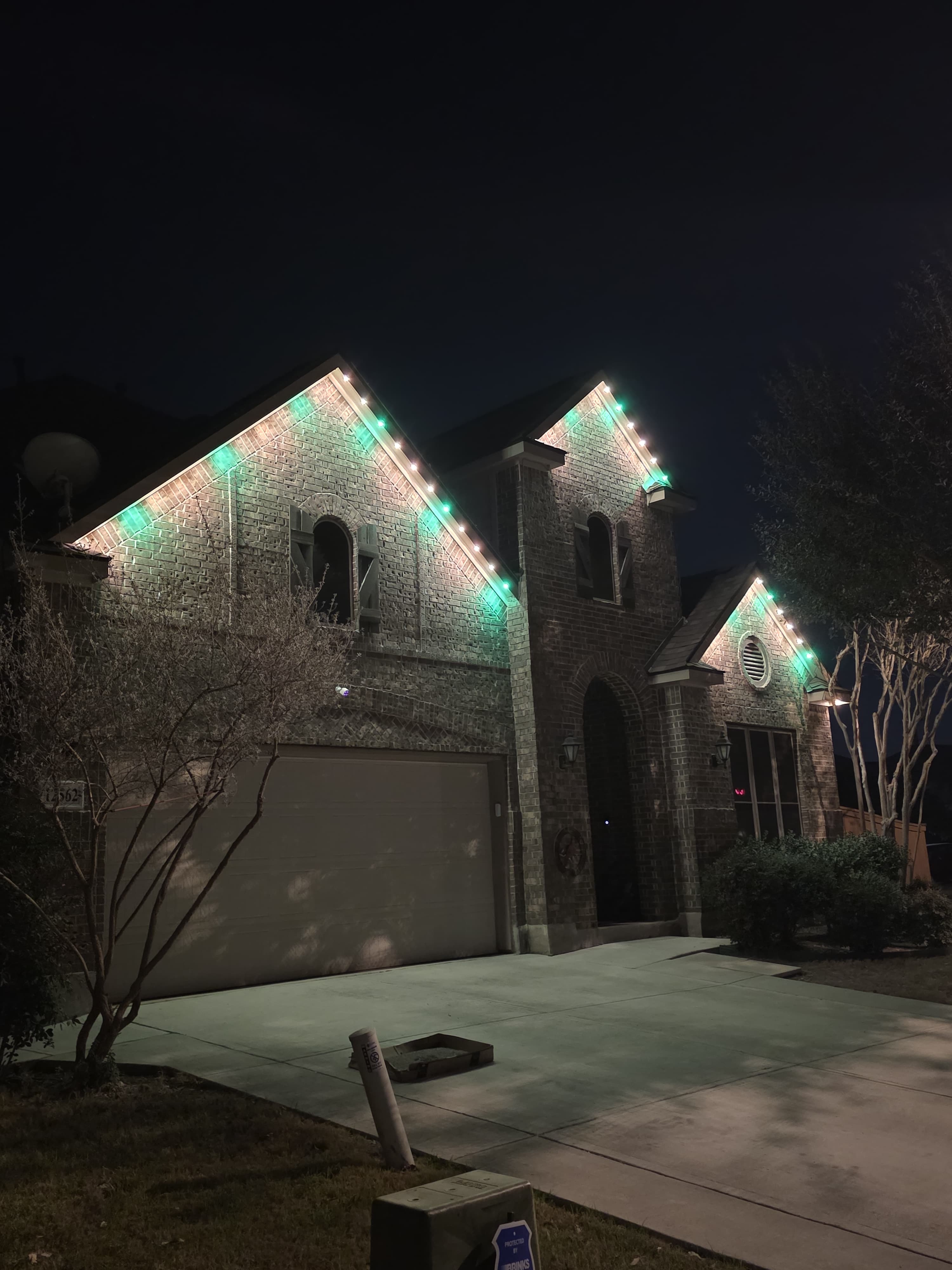 Complete architectural outline lighting along every roof edge and trim of a Texas home
