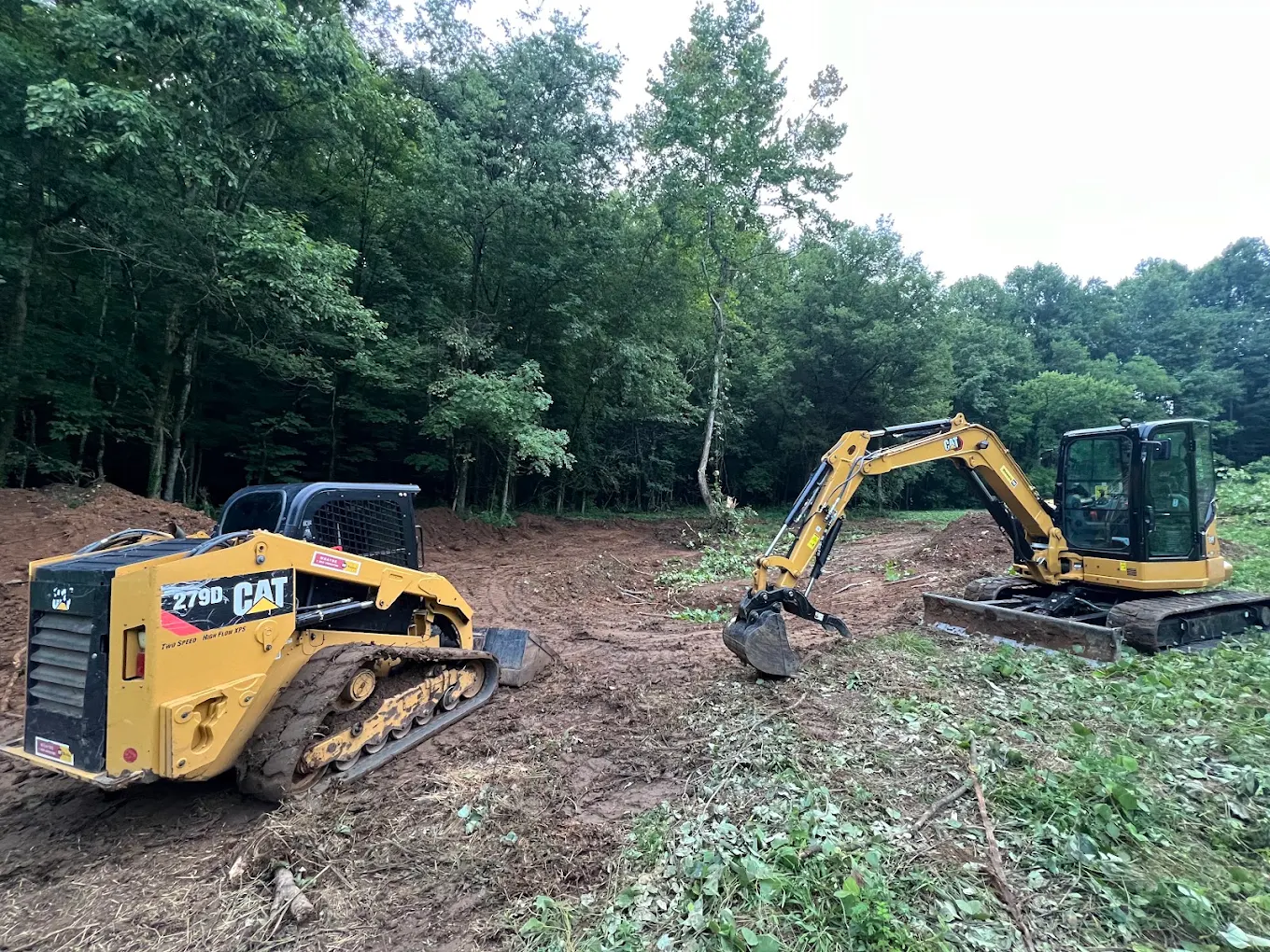 Track loader on freshly graded soil.