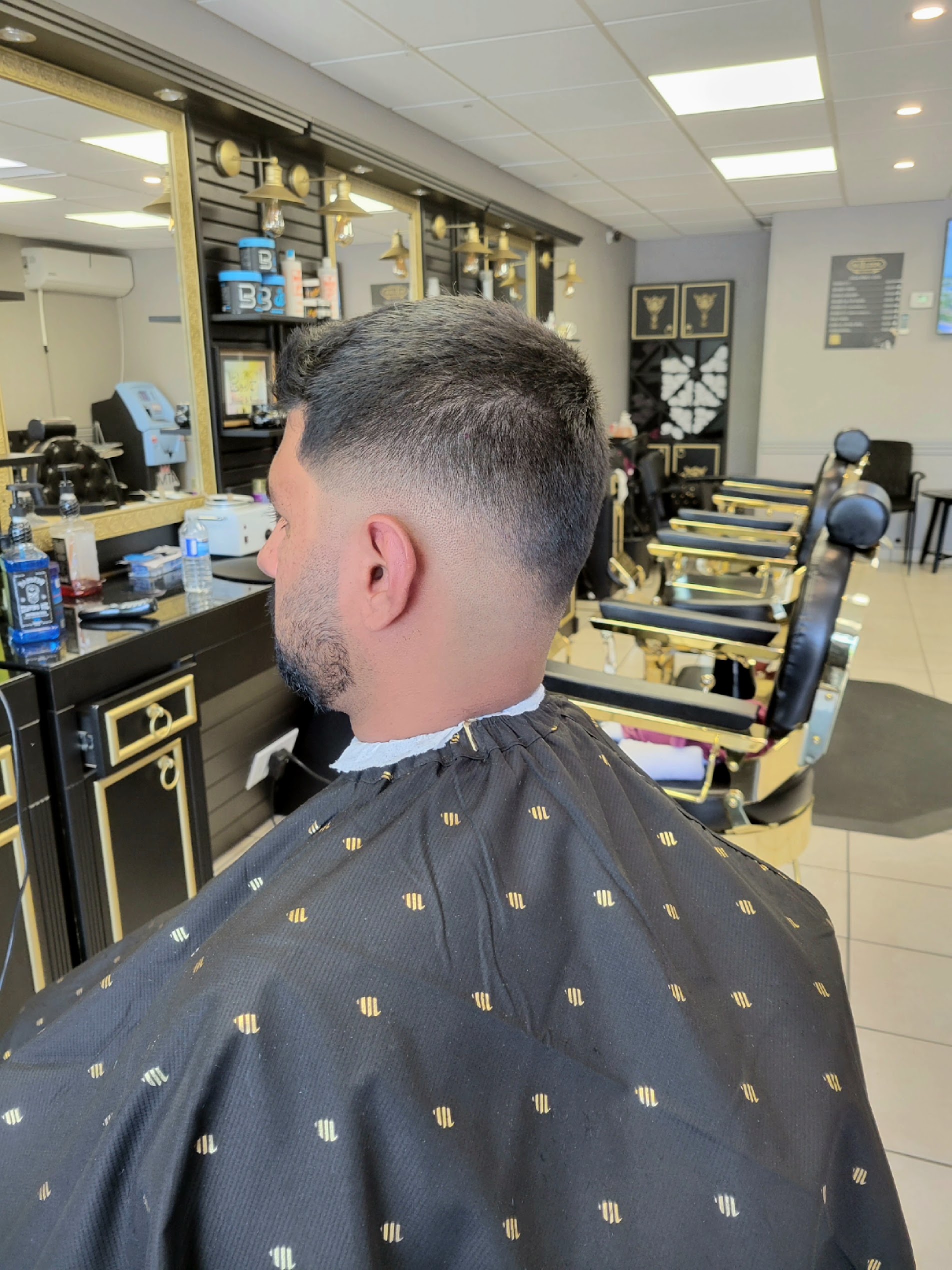 Precision mid skin fade and clean blend at Nu Look Barbershop