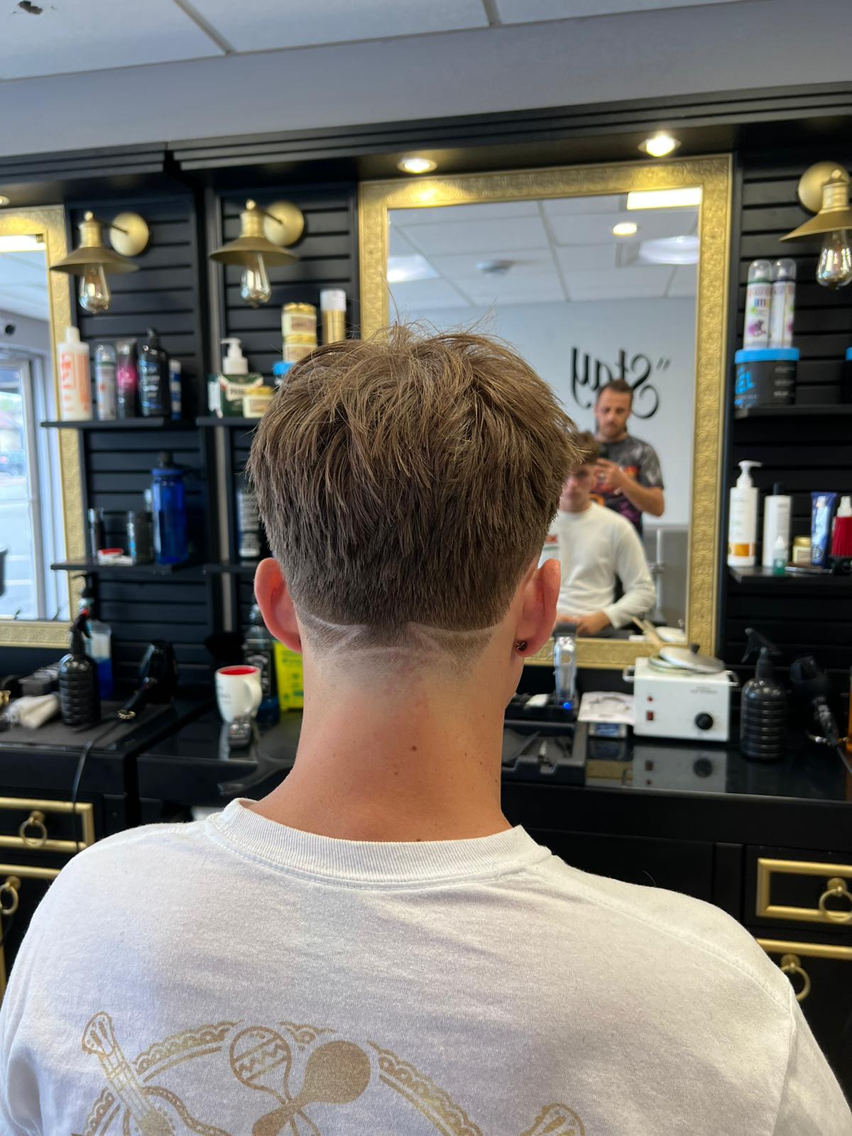 Textured taper neckline with custom shaved geometric line design
