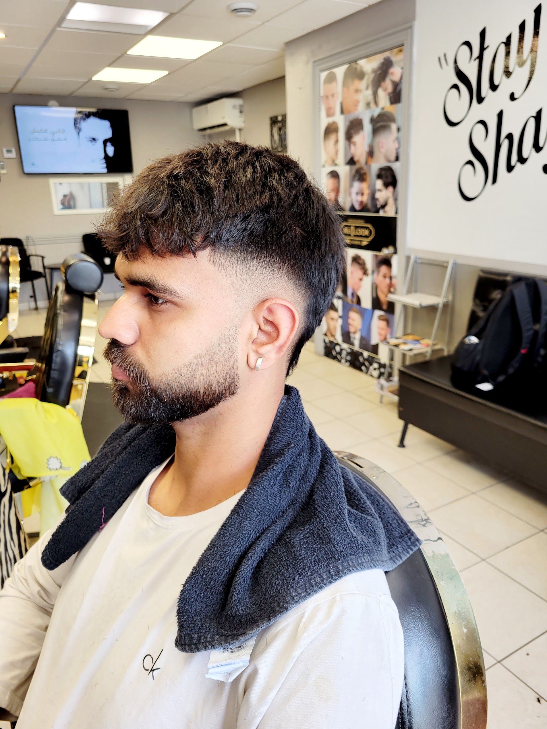 Textured crop fade and sharp sculpted beard line-up