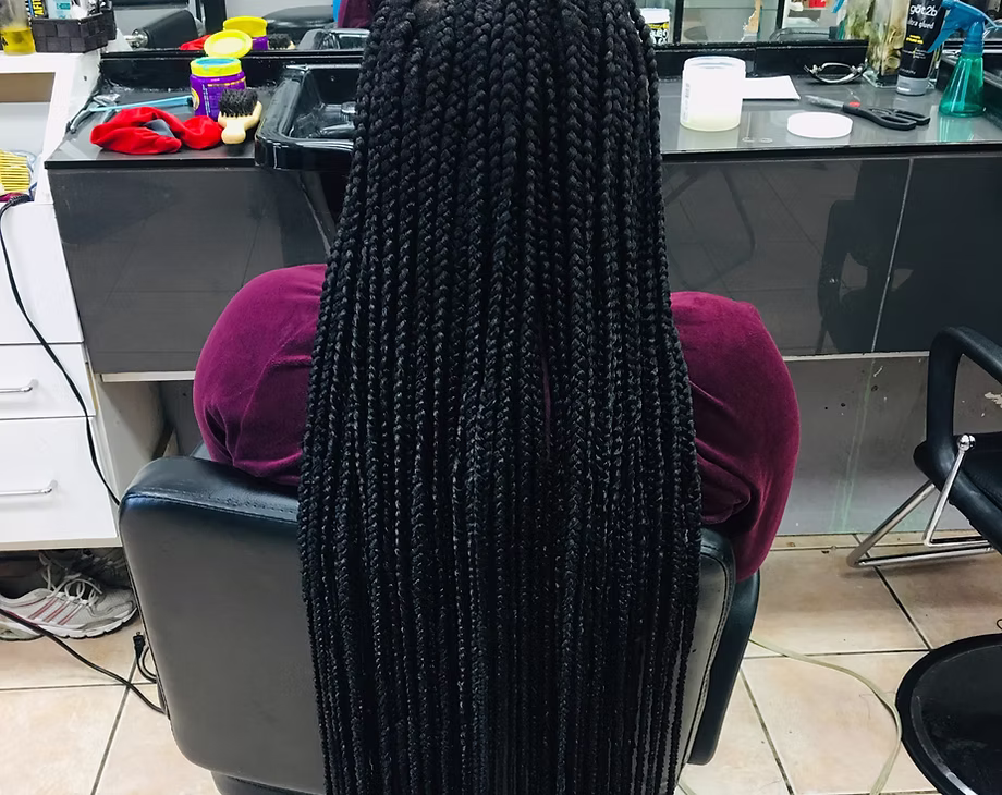 Floor length neat box braids and styled finish by La Salon in Pickering, Ontario