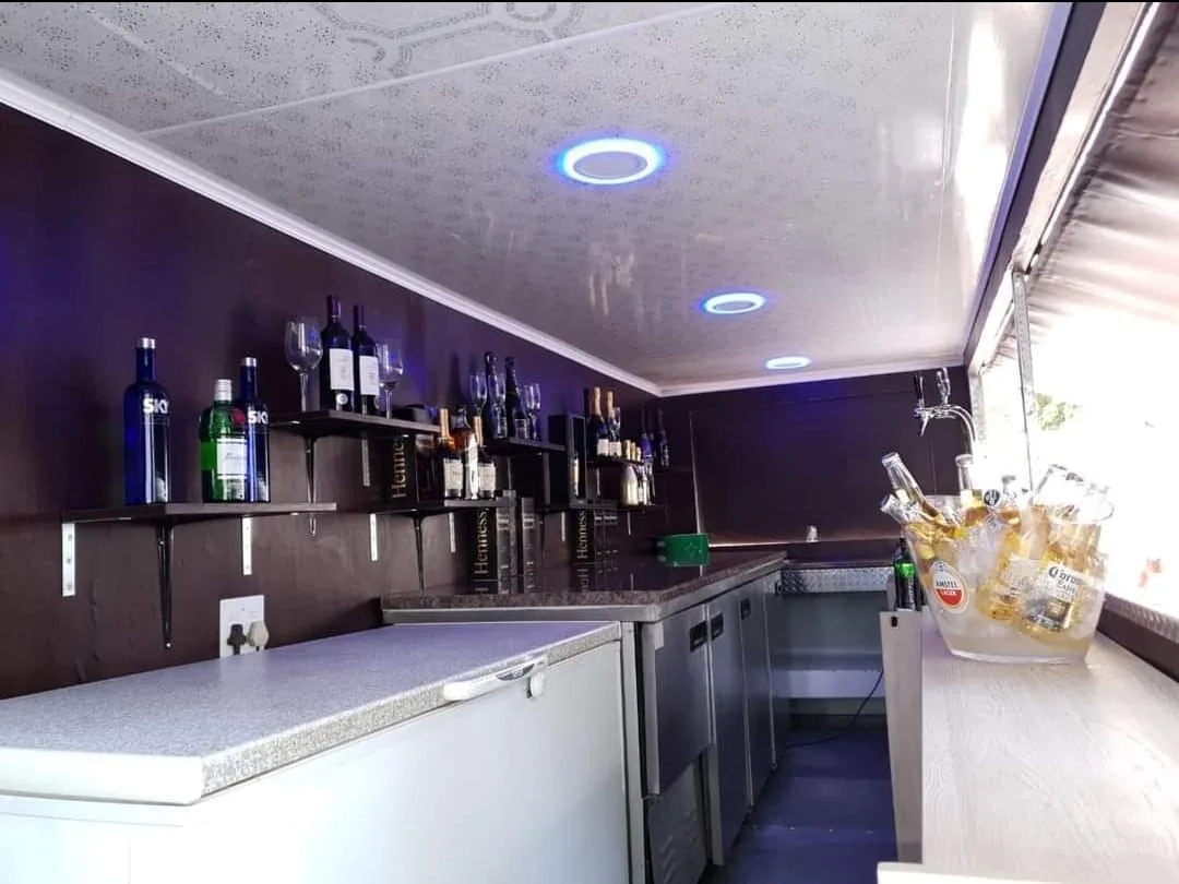 Serving counter and drinks display inside Bar Zone