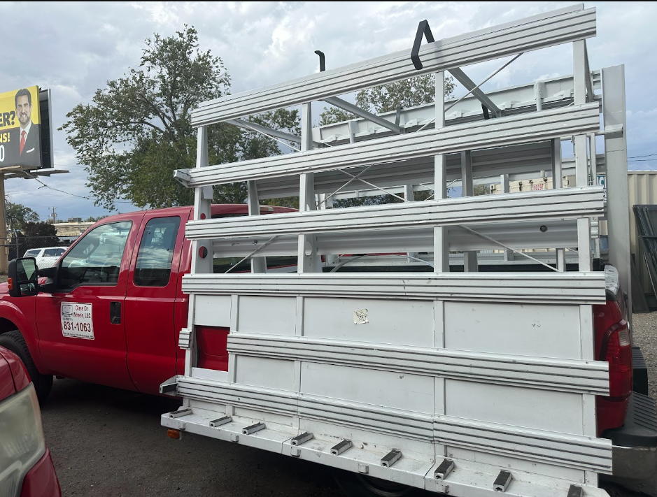 Red Glass on Wheels service truck fitted with heavy-duty glass-carrying aluminum rack