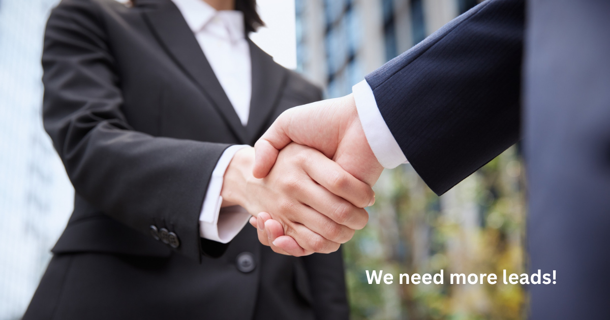 Business handshake representing qualified lead acquisition, customer partnerships, and systems that convert interest into revenue