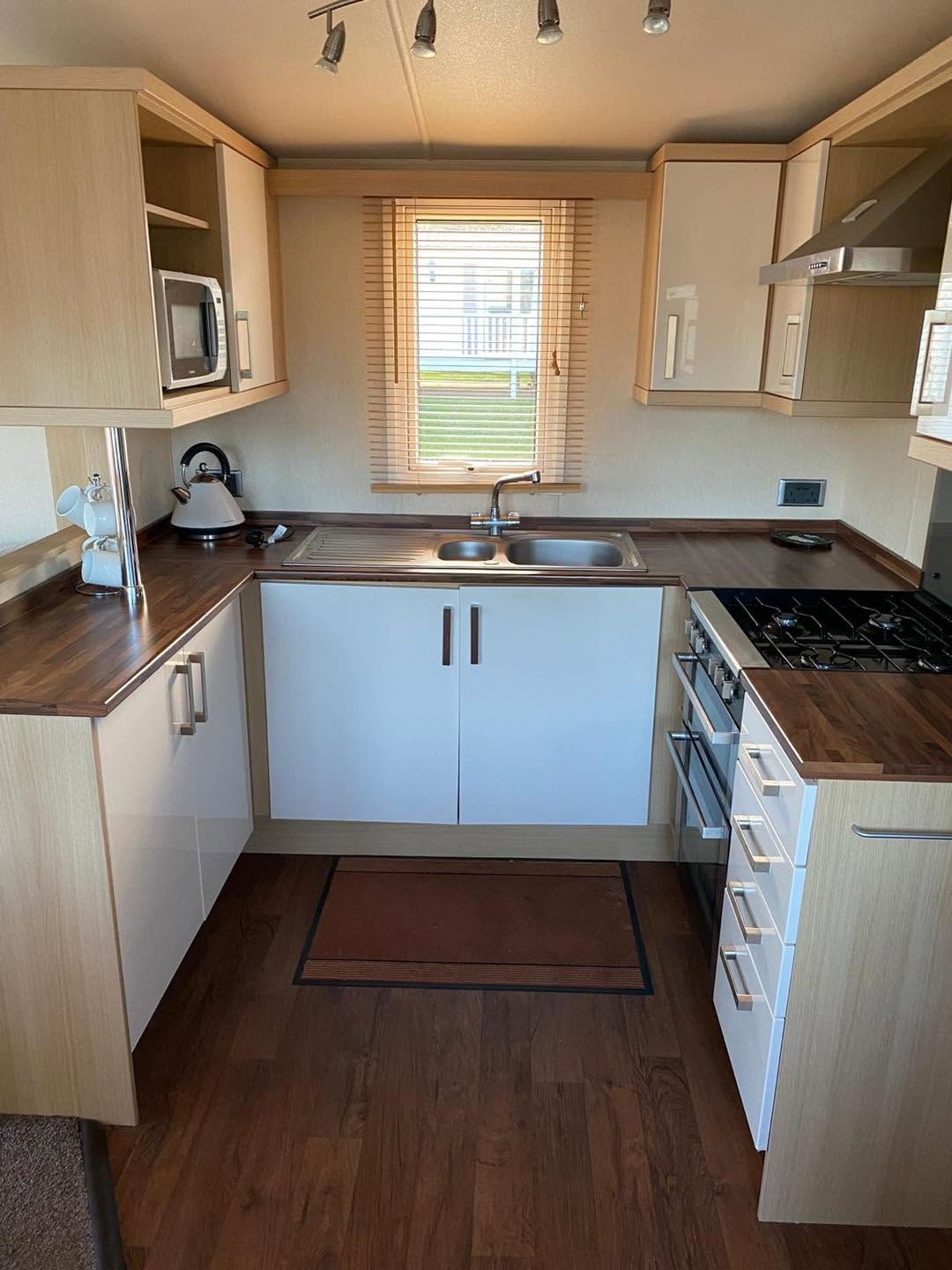 Contemporary fitted kitchen with appliances and ample storage
