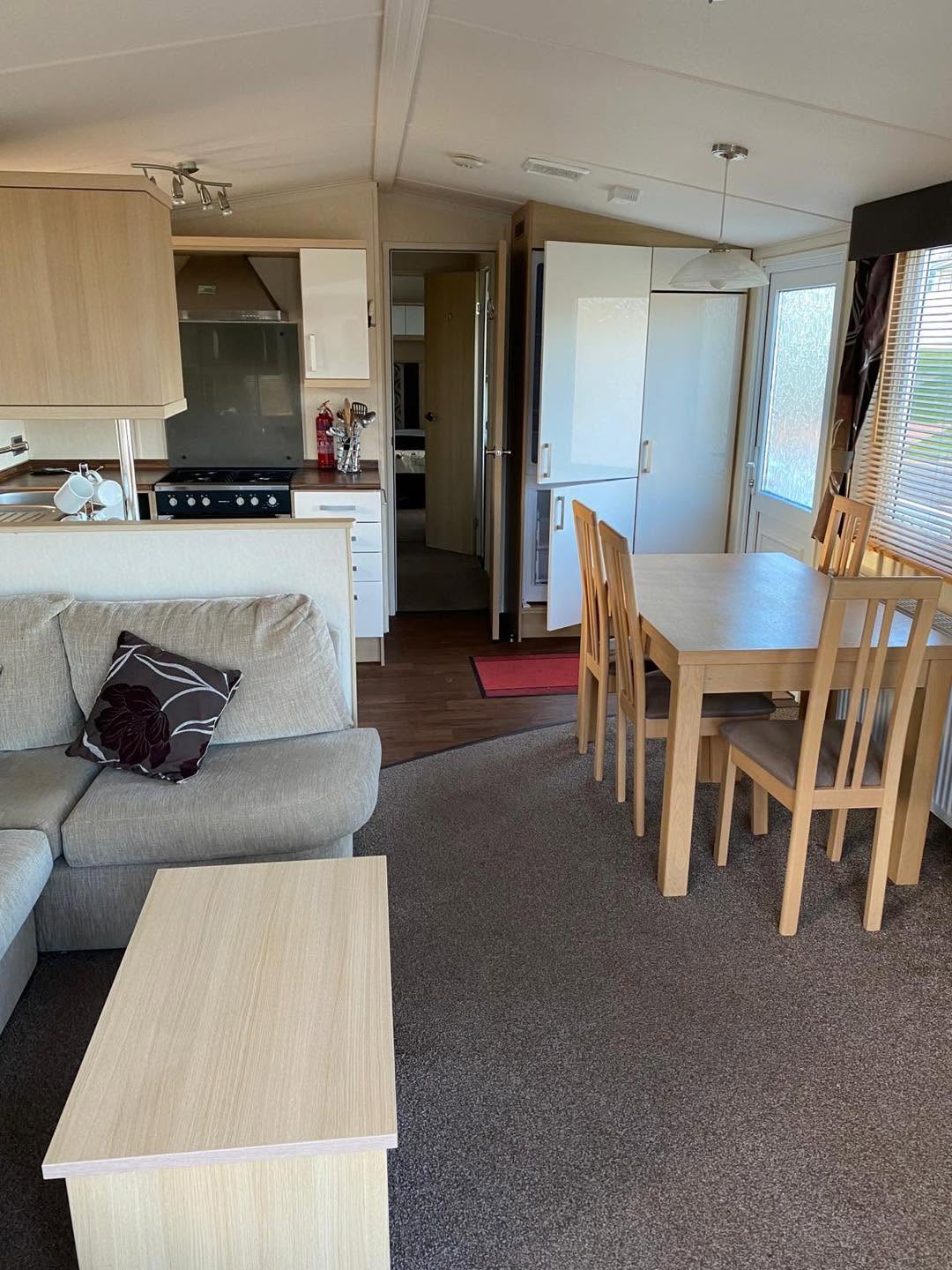 Spacious open-plan lounge and dining area in holiday home