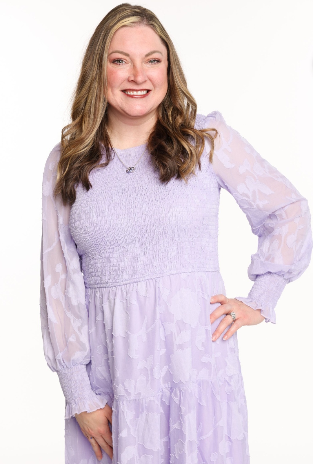 Amber Renee Till in lavender dress ready to help you reset and rise