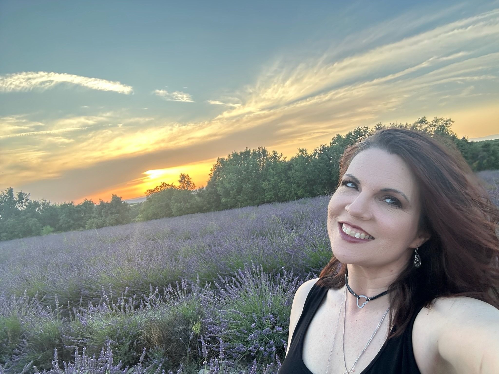 Rachel Harris smiling at sunset in a lavender field, the JOY Coach and creator of Good Girl Ghosting