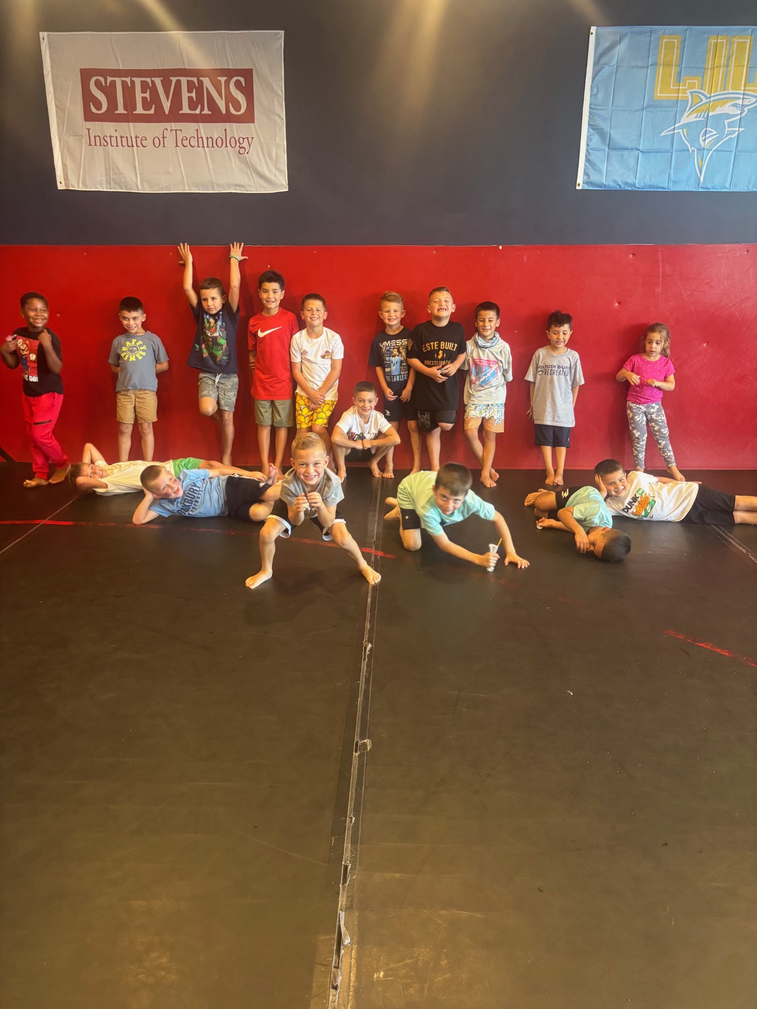 Group of smiling children at a birthday party at Este Built Wrestling Club