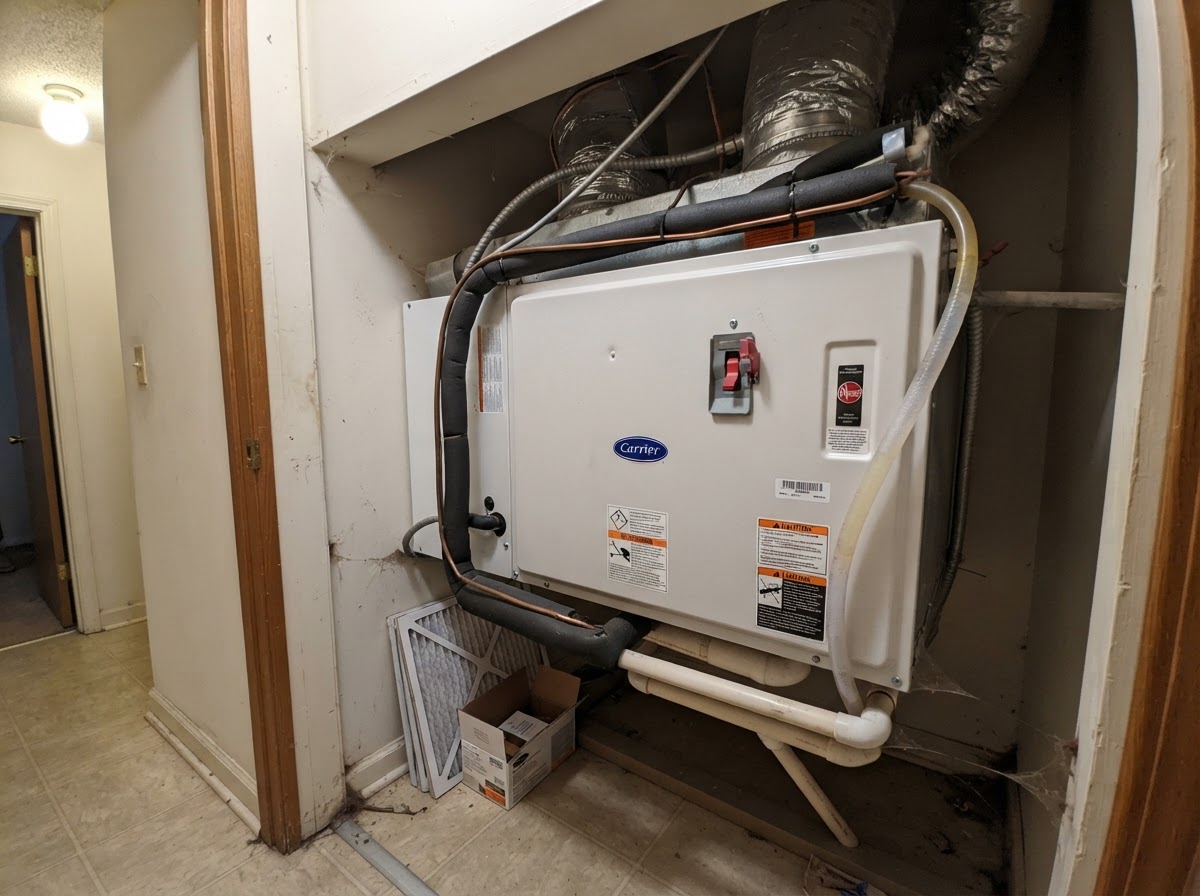 Indoor air handler unit in a residential utility closet