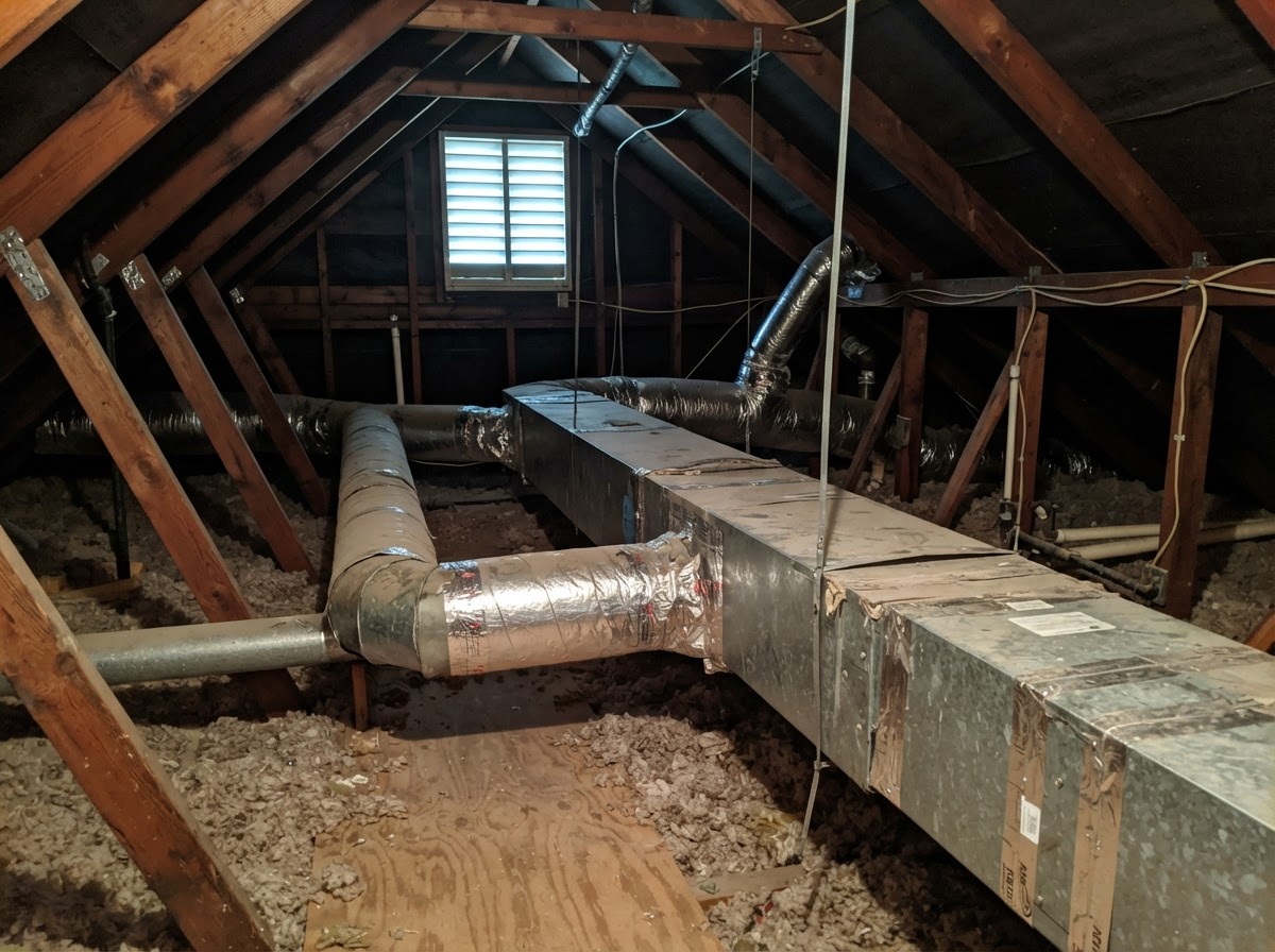 HVAC sheet metal ductwork in an attic