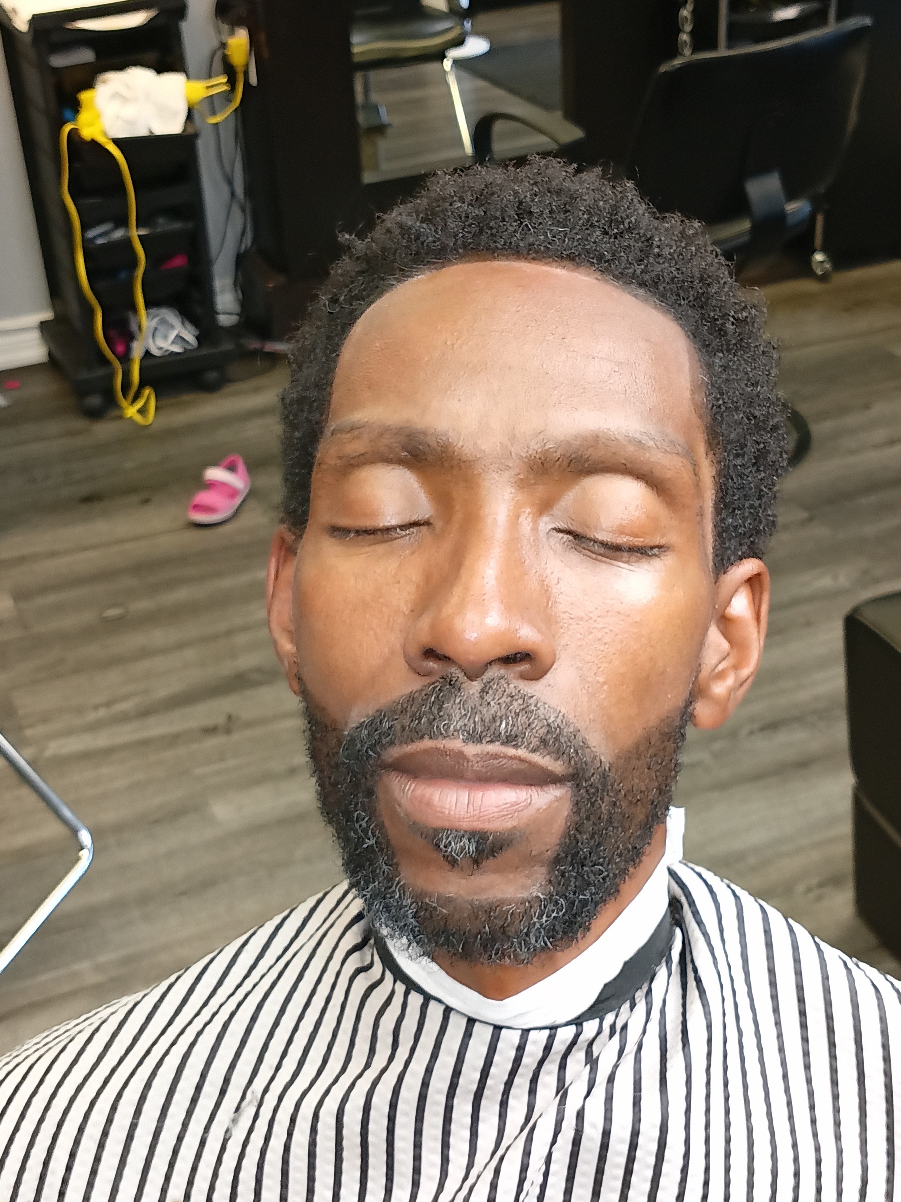 Crisp symmetrical front hairline lineup and sculpted full beard grooming at Image Barber Studio