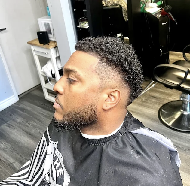 High-definition drop fade with textured coil curls and razor-sculpted beard edge-up at Image Barber Studio