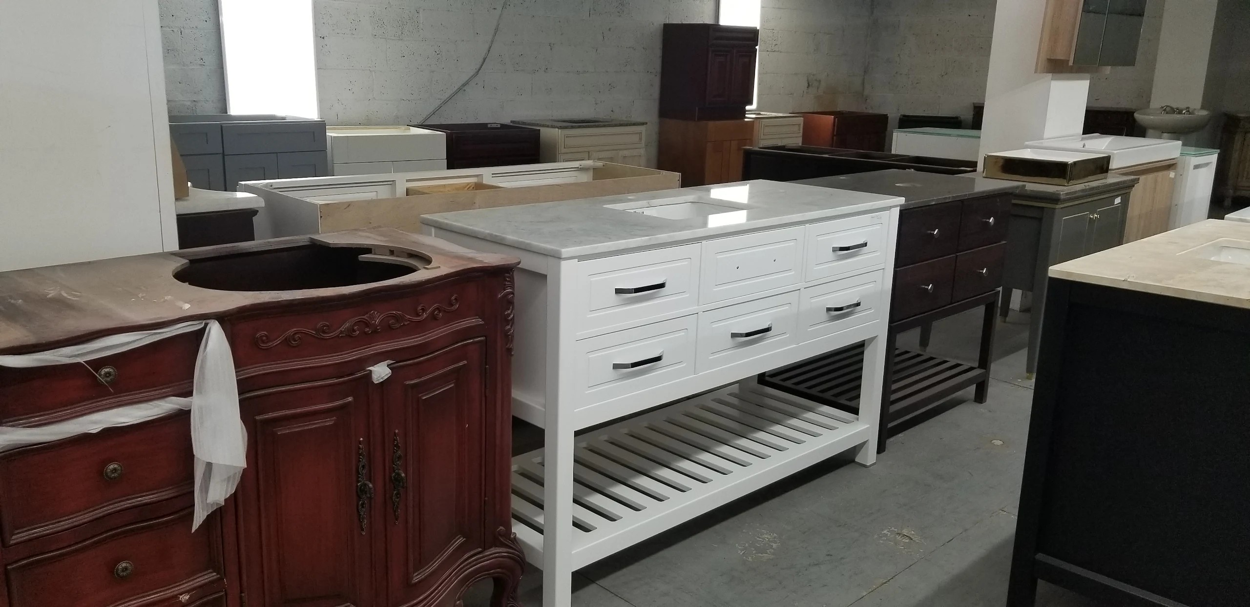 Warehouse showroom with bathroom vanities and stone tops on display