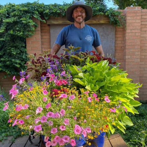 Matthew Davis with custom flower and plant arrangements