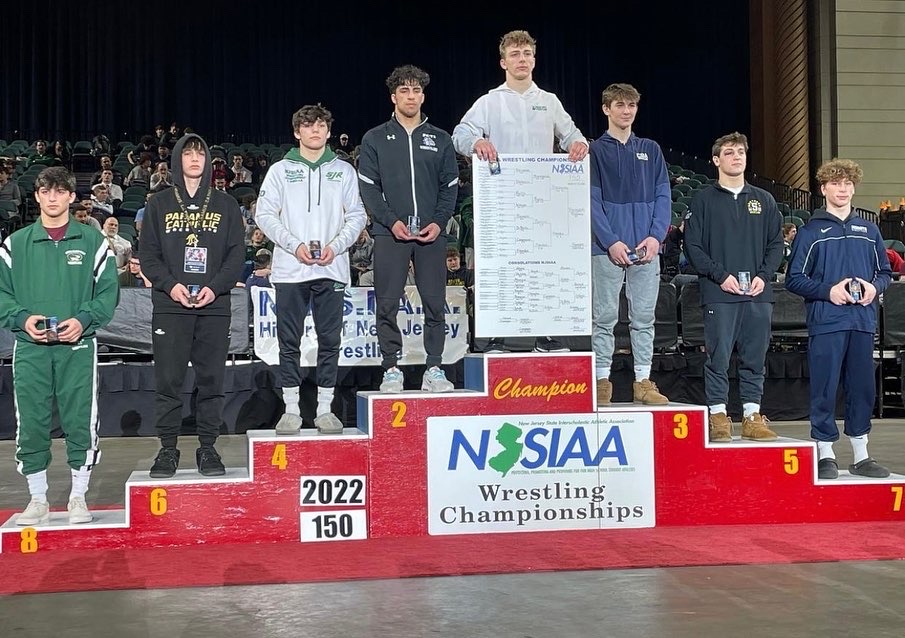 Este Built wrestler with a tournament medal