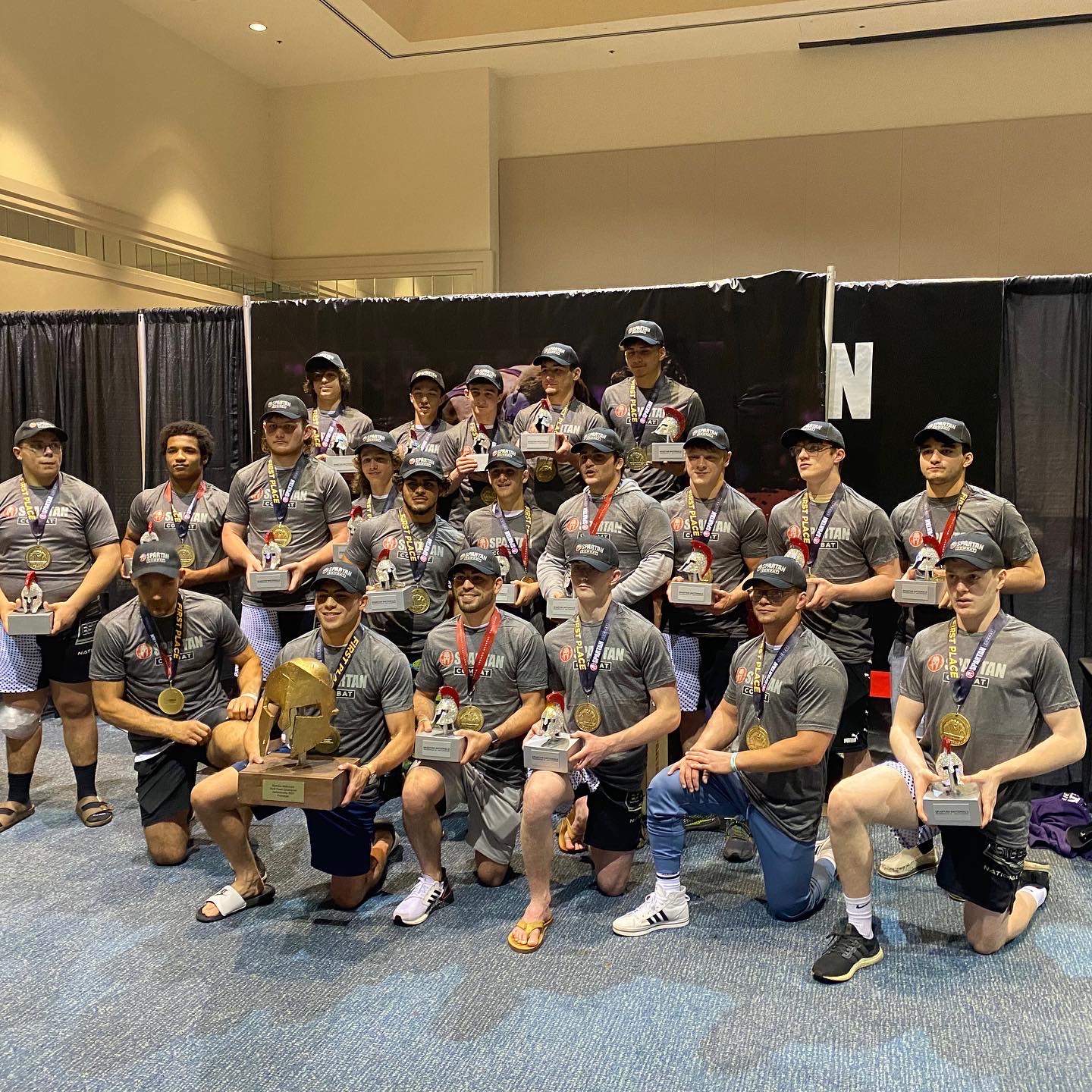 Este Built wrestlers posing after a tournament