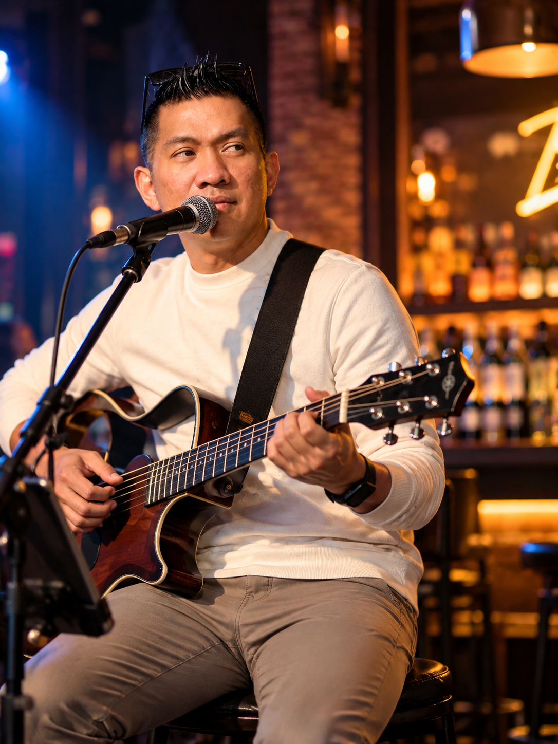 Ice Aquino performing live with acoustic guitar