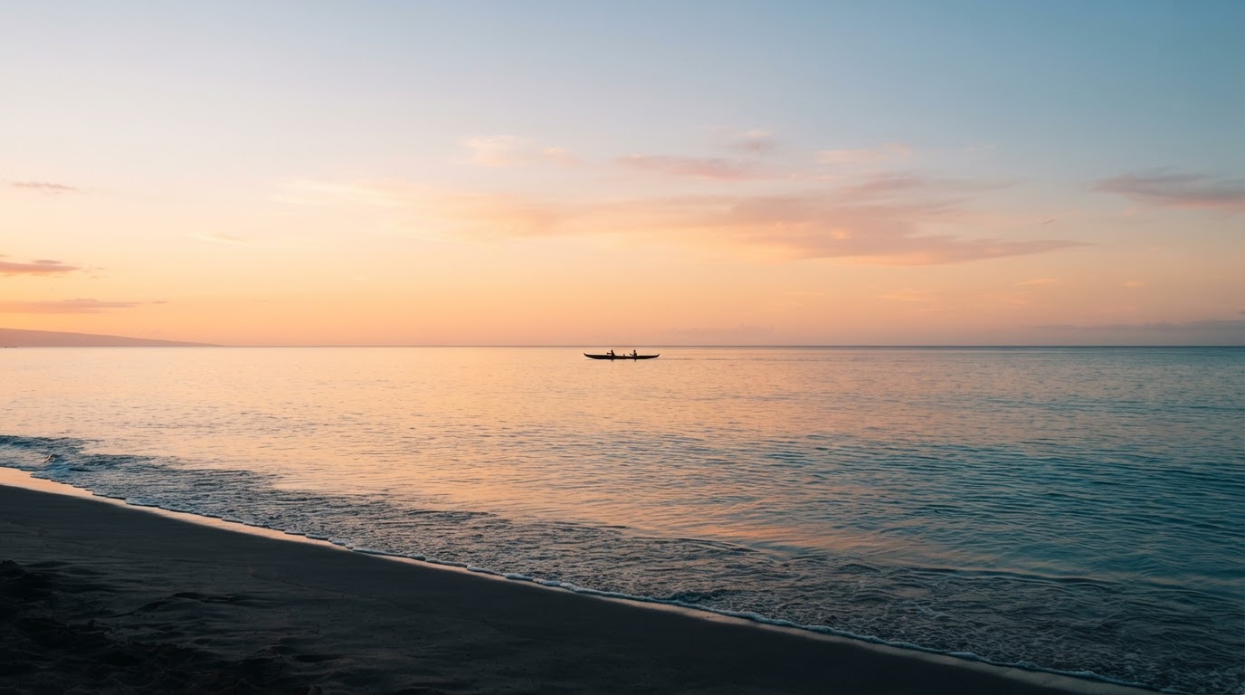 Calm Maui ocean horizon at dusk with soft warm sky