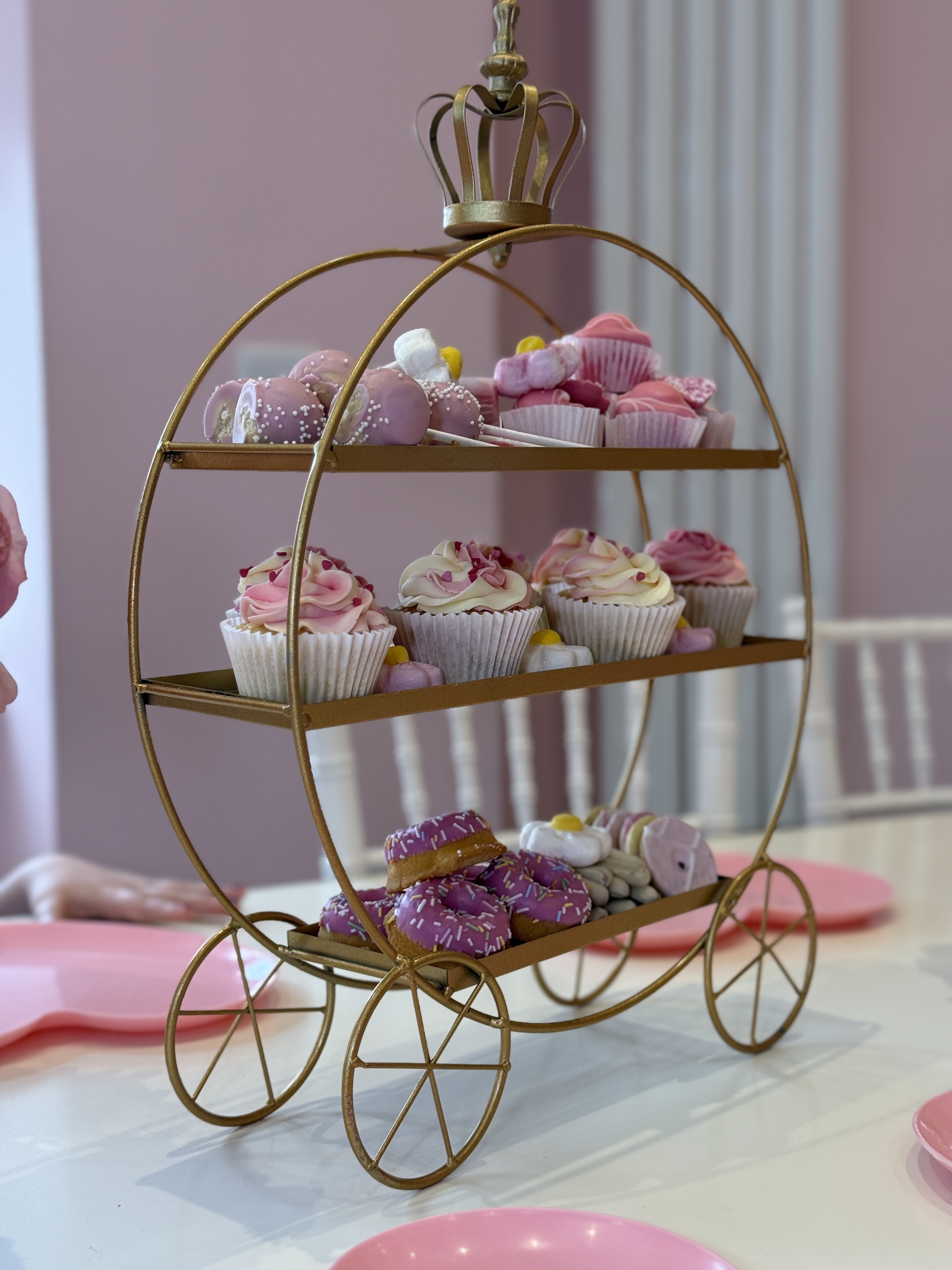 Crowned golden carriage with cupcakes, cake pops and sprinkle mini-donuts