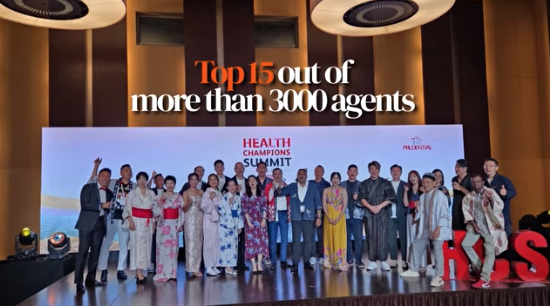 Raymond Lim on stage at the Health Champions Summit — Top 15 of 3,000+ agents