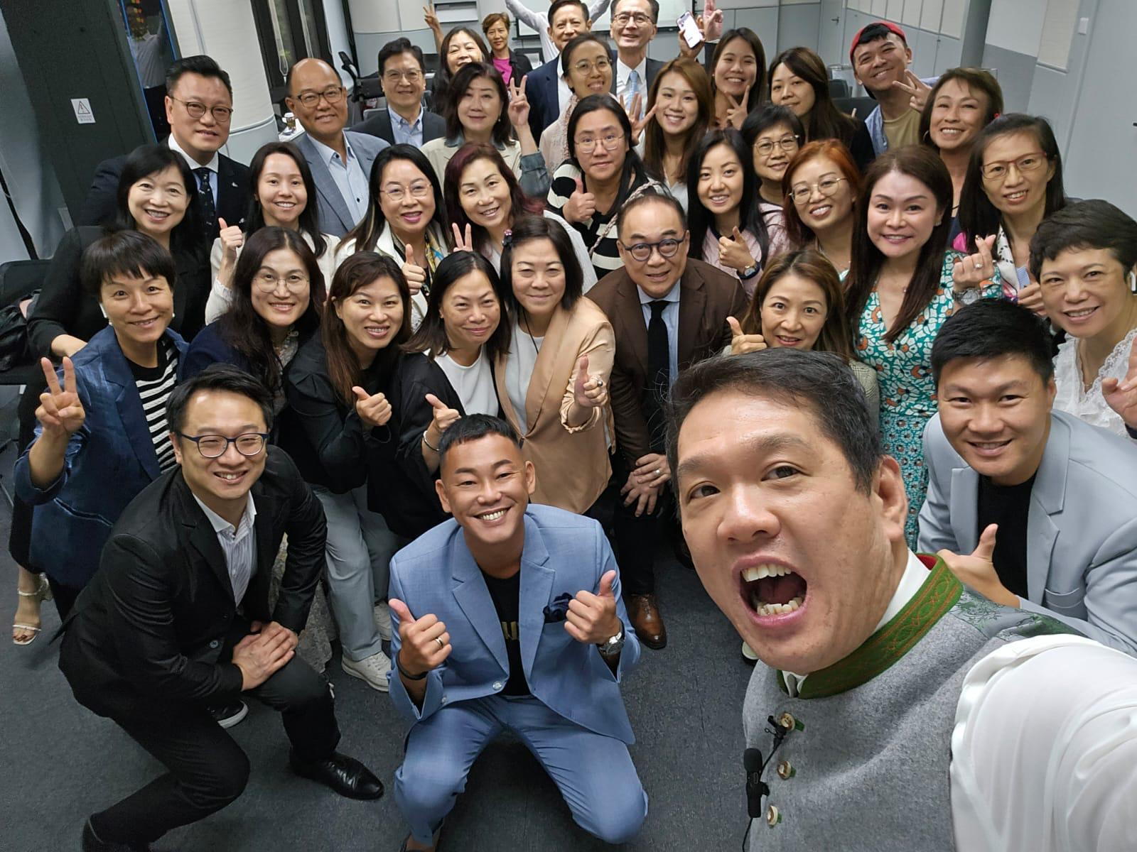 Raymond Lim with large agency team group celebrating together