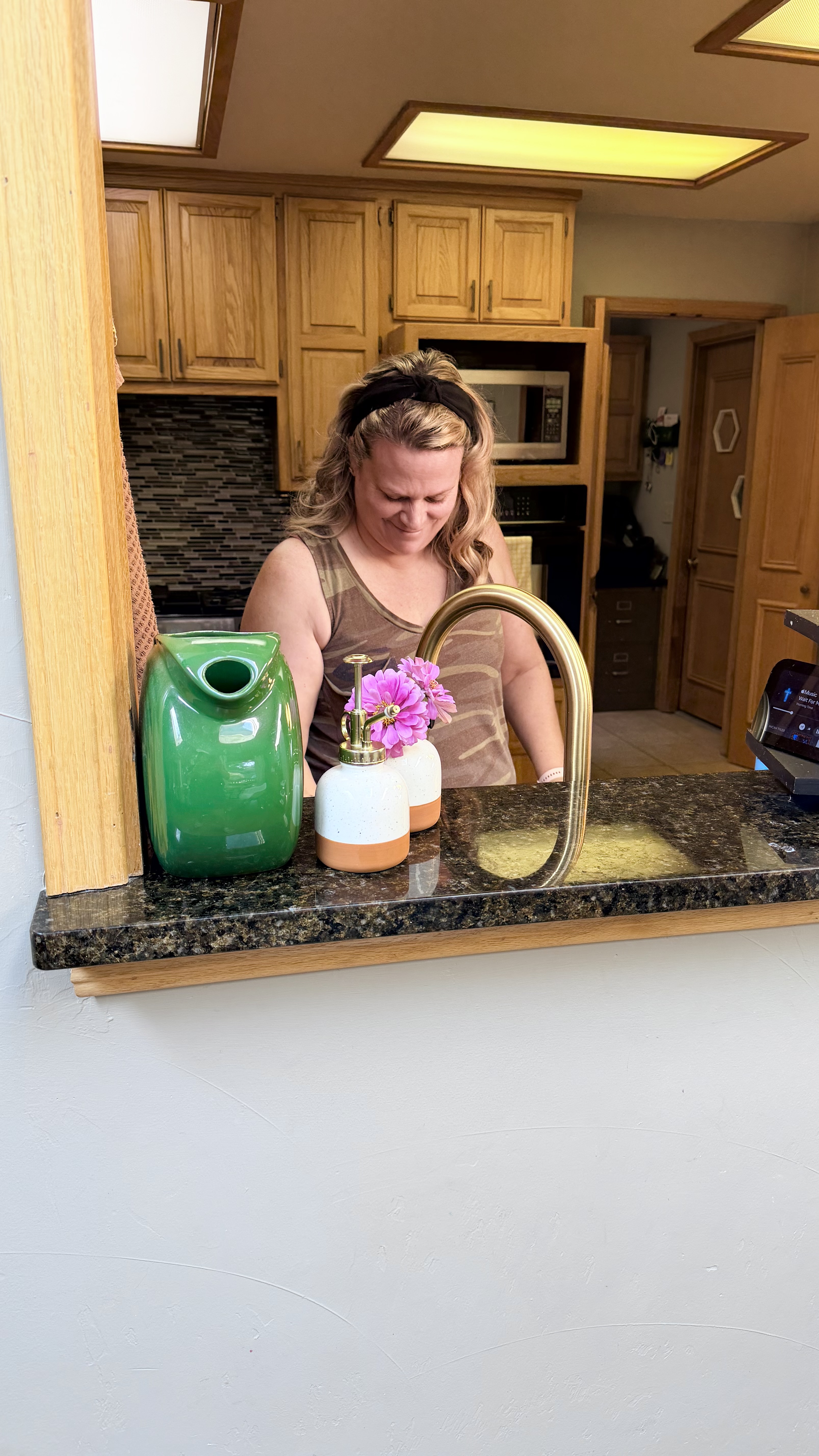 Becky smiling in kitchen