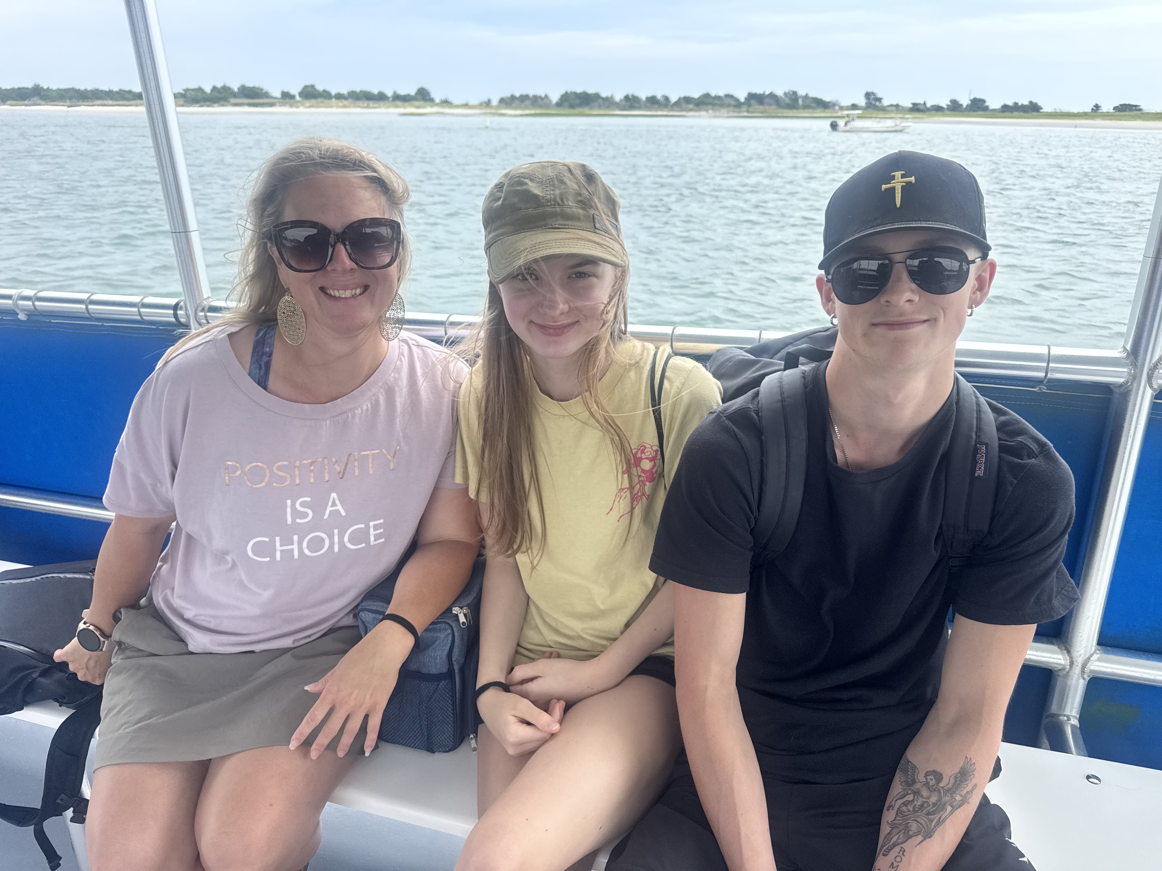 Carrie with her kids on a boat trip