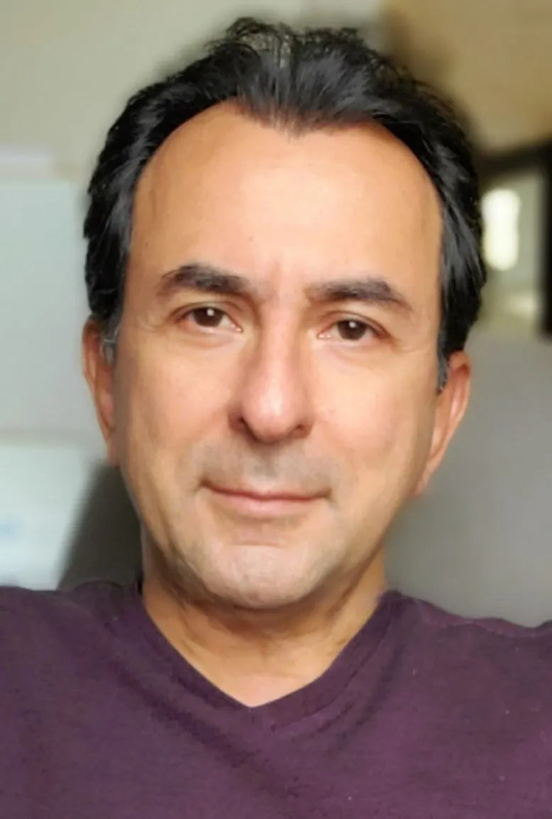 Portrait of Dr. Kalal Derhami, DDS, MSc, PhD