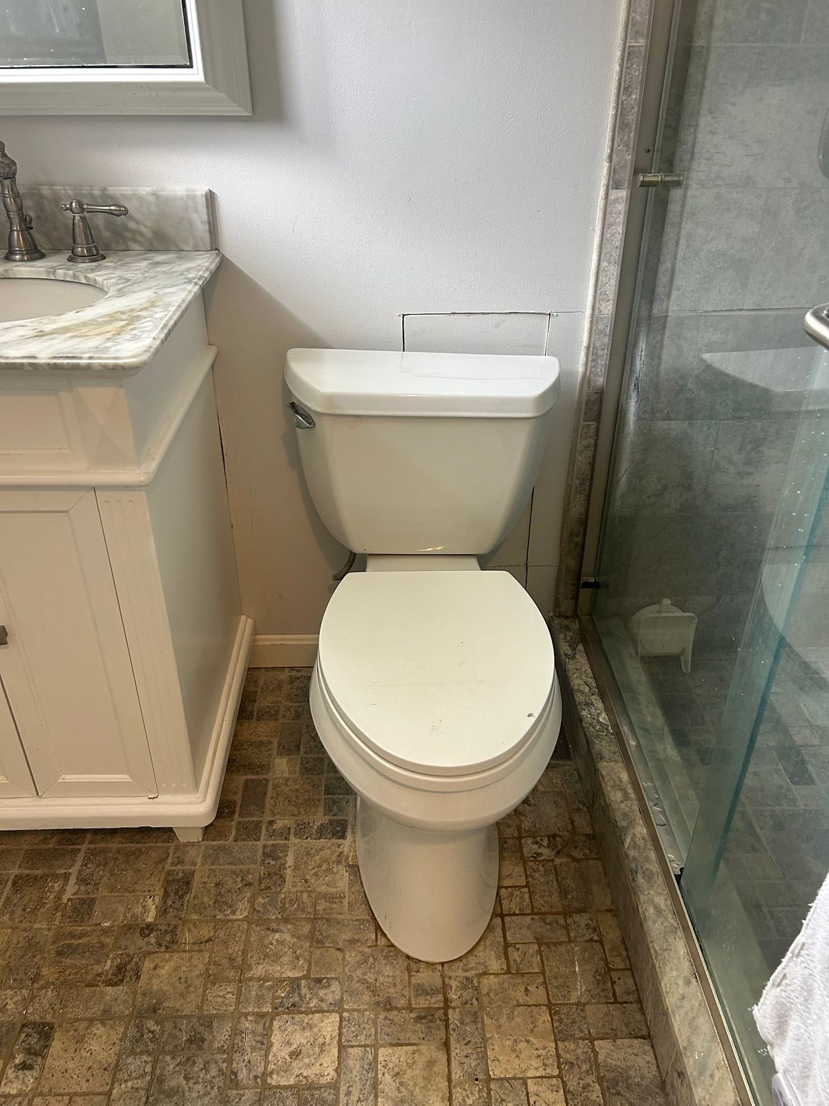 Toilet reset in the bathroom after the drain repair