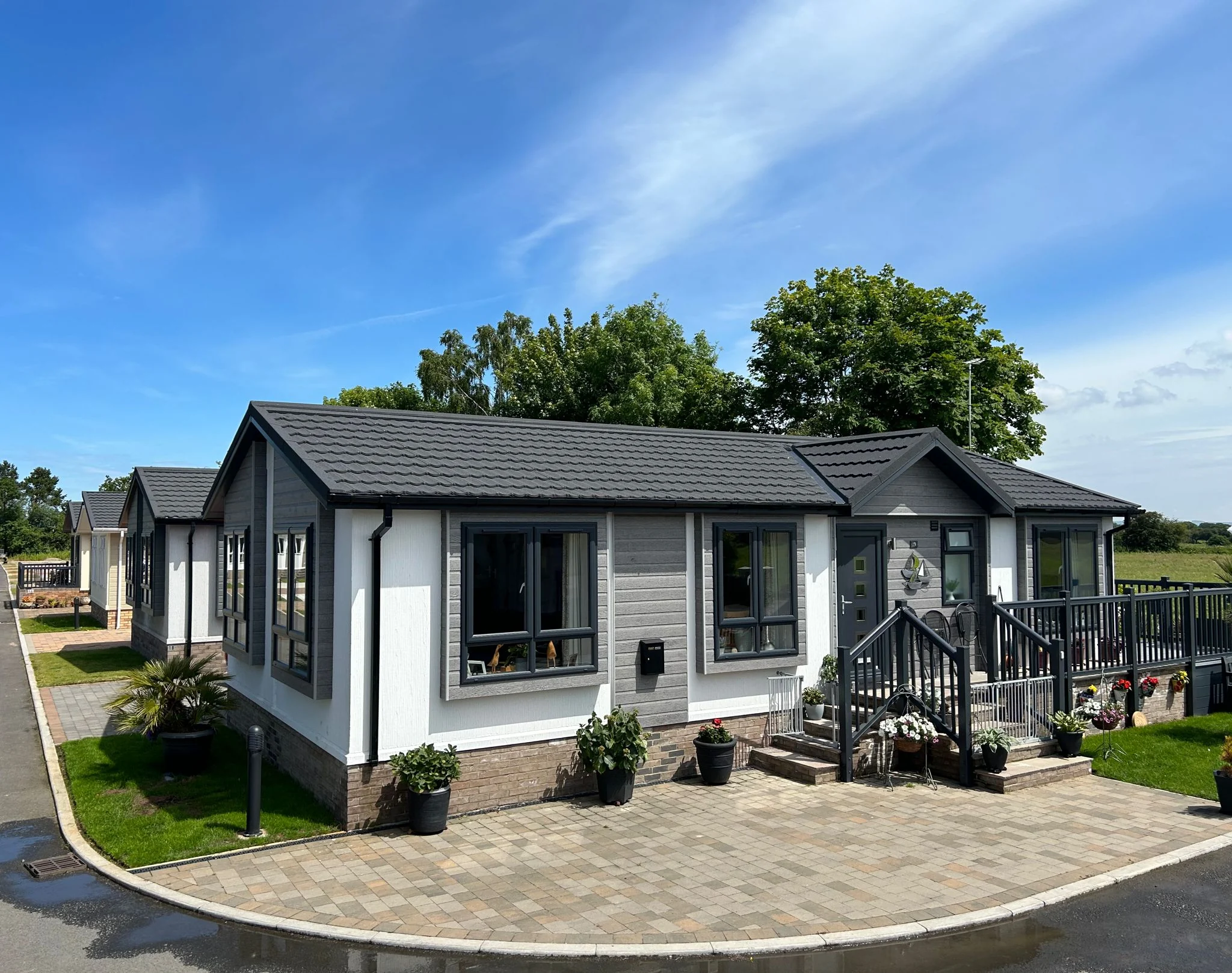 Contemporary residential park home with covered porch at Elvington