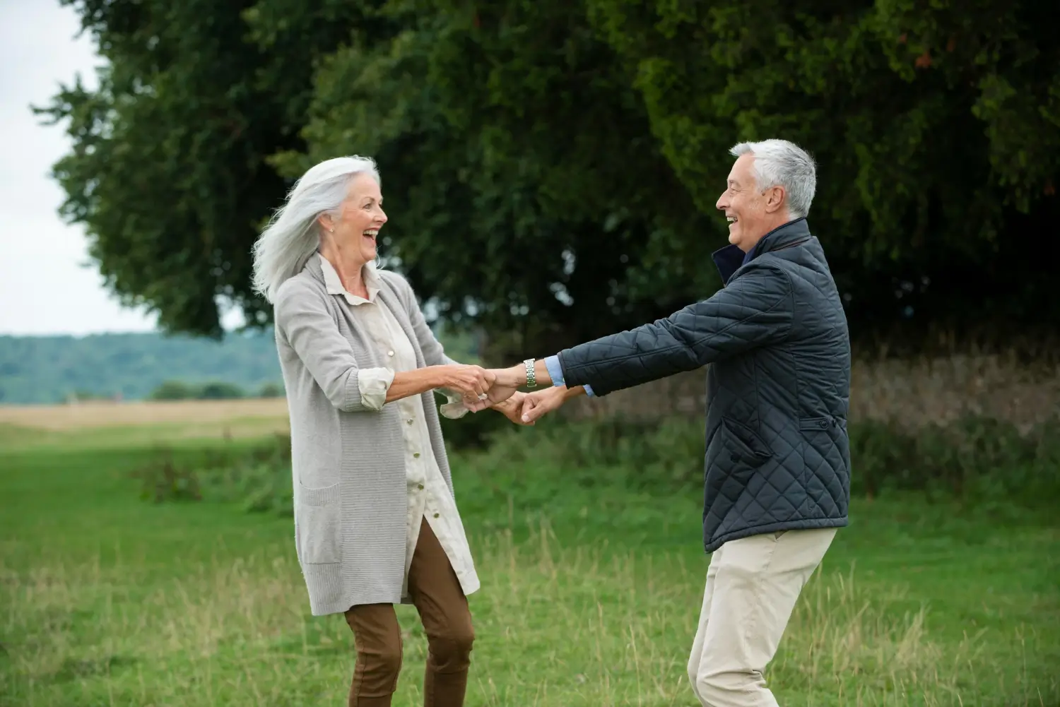 Happy retired couple enjoying their new lifestyle in the countryside