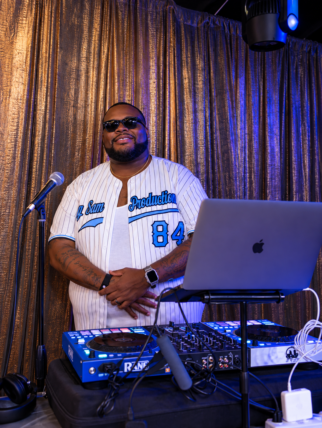 DJ Big Sam live behind his Rane turntables in custom DJ Sam Productions jersey