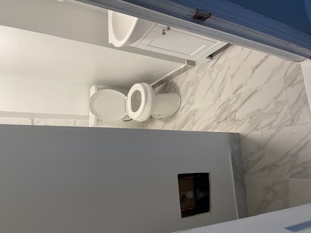 Post-Renovation Bathroom Grout Dust & Marble Tile Detailing