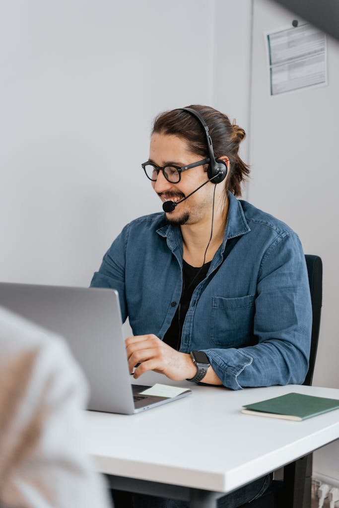 Volunteer answering calls and serving as a Hope Advocate with a headset and welcoming expression