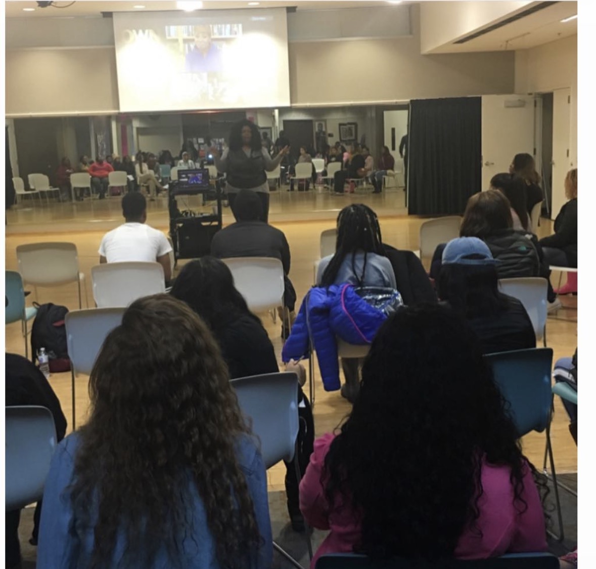Tyra Steverson facilitating a large interactive workshop in an auditorium