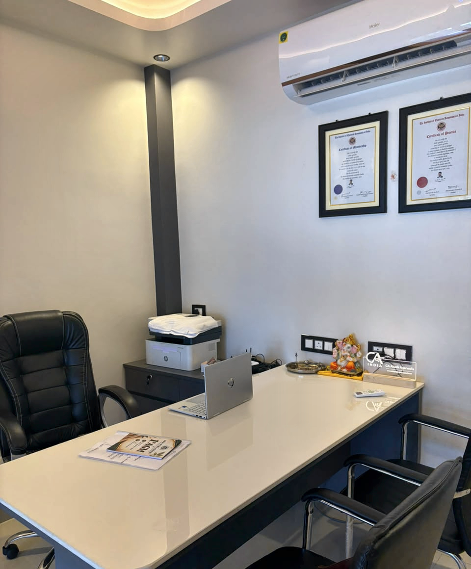 The principal desk and consultation area at the office of Akash Agarwalla & Co., Chartered Accountants, Malbazar.