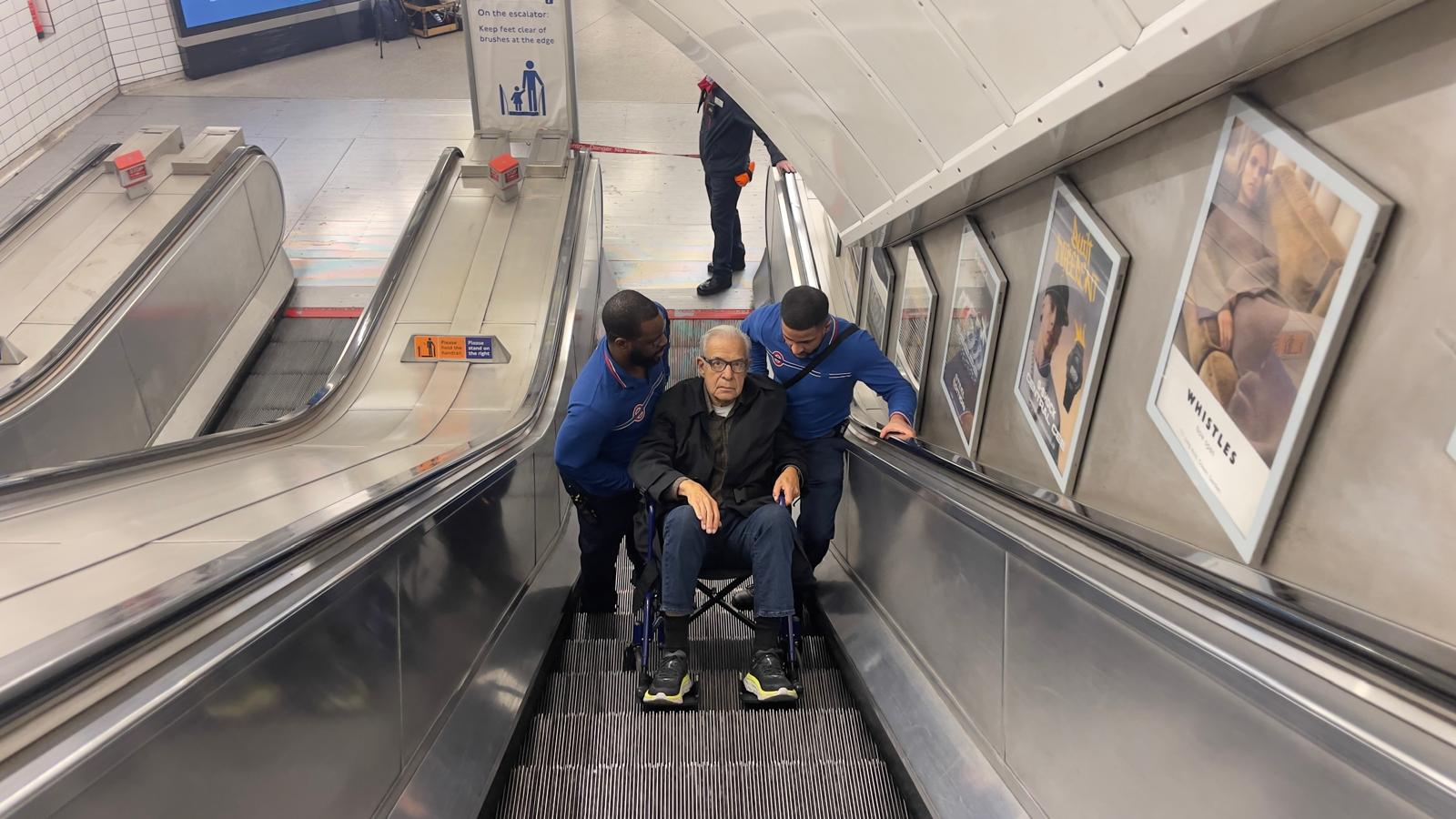 Lanny on the London Underground escalator, adventurous spirit undaunted